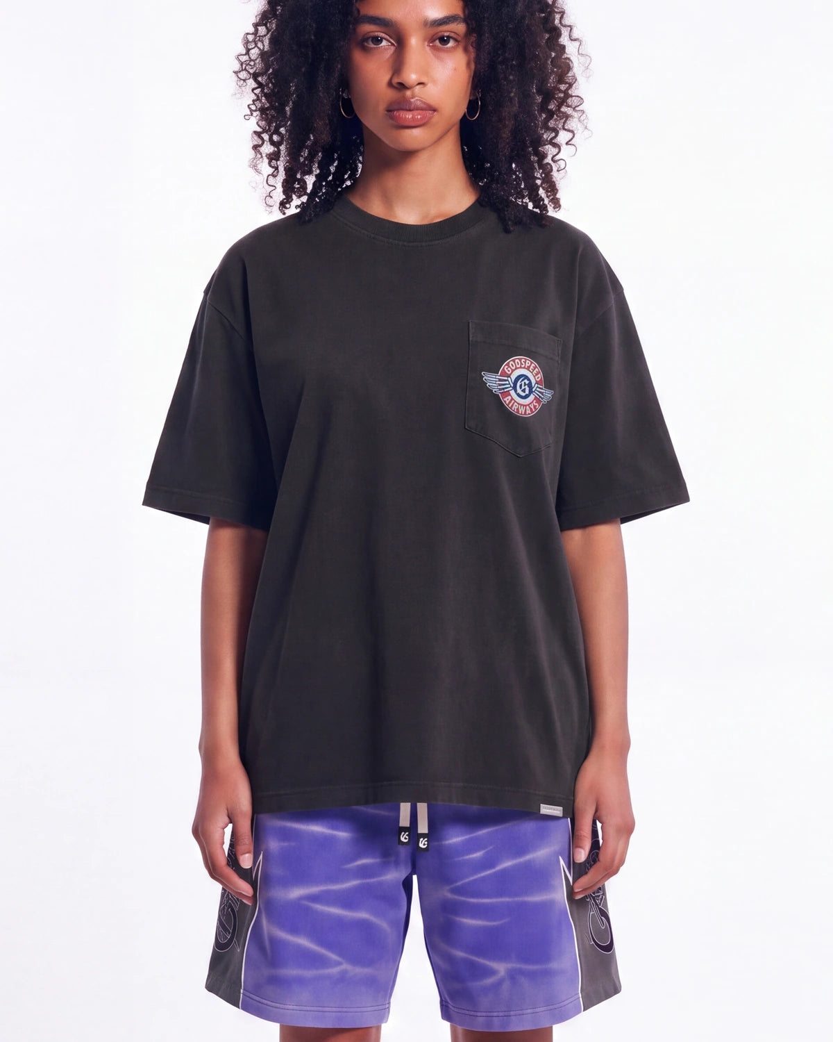 Godspeed GS Air NYC Pocket Tee black, upper body front view on model showing the GODSPEED AIRWAYS chest pocket roundel