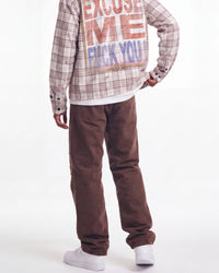 Bravest Studios Liberty Flare Denim brown, waist-down rear view on model showing the flared brown denim