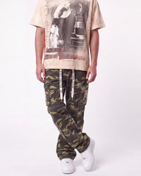 Mixed Emotions ME Camo Cargo Pants green camo, waist-down front view on model showing the stacked camo leg
