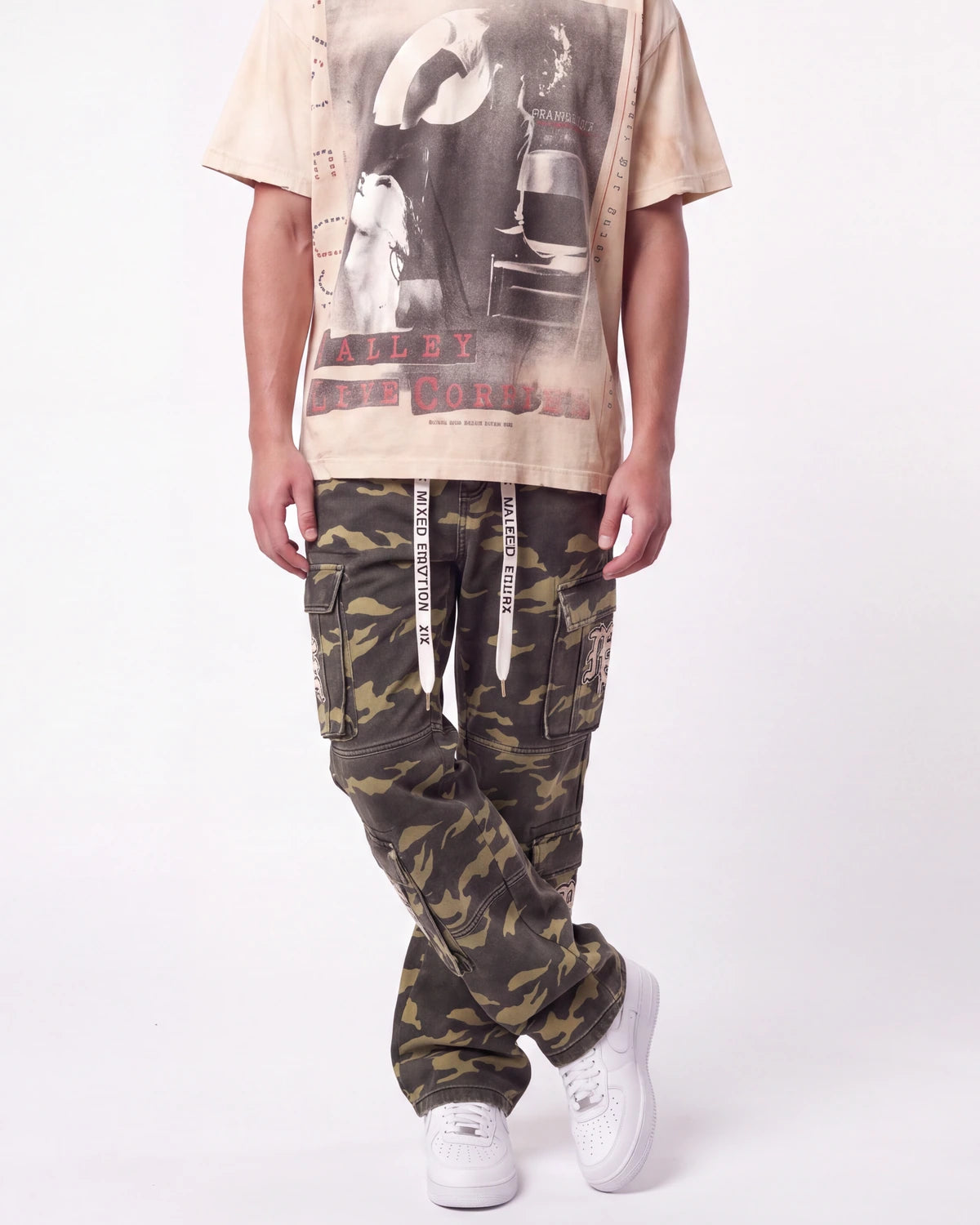 Mixed Emotions ME Camo Cargo Pants green camo, waist-down front view on model showing the stacked camo leg
