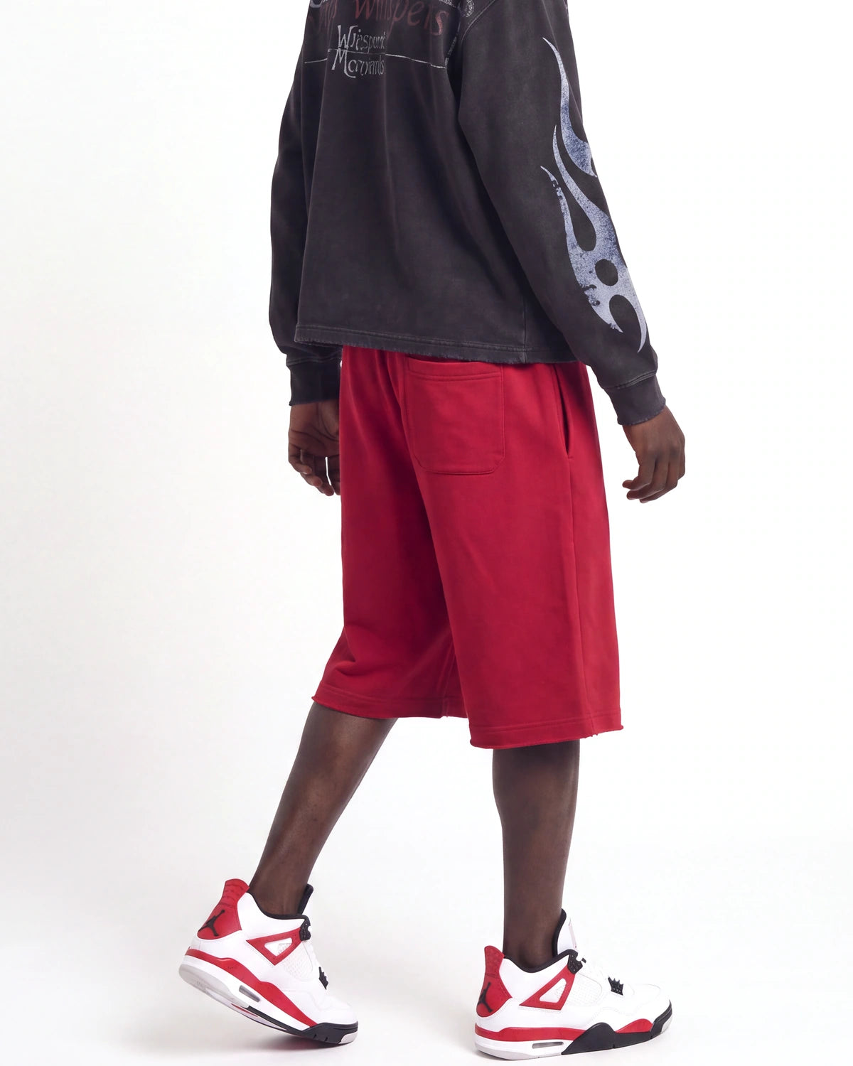 Saint Vanity Crimson Uniform Shorts red, waist-down side view on model showing the crimson fleece
