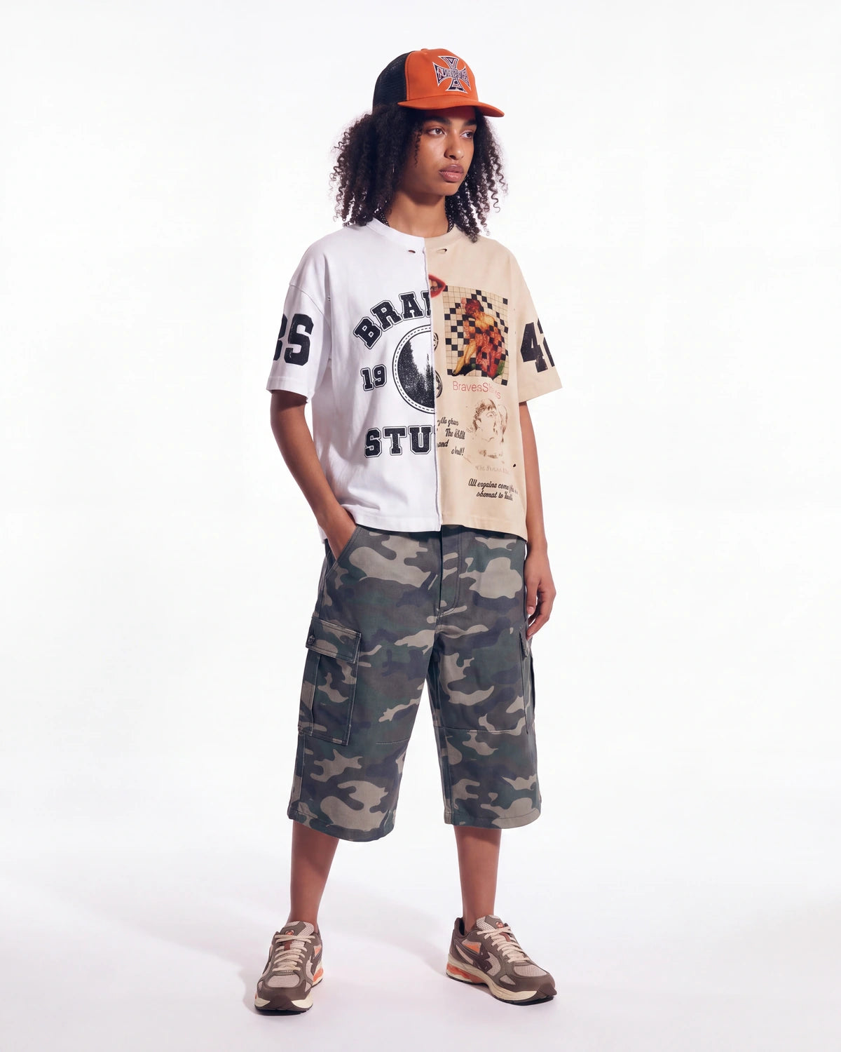 Restock AR Outfit #41, split-panel varsity tee styled with grey-green camo carpenter shorts and an orange trucker cap, full look
