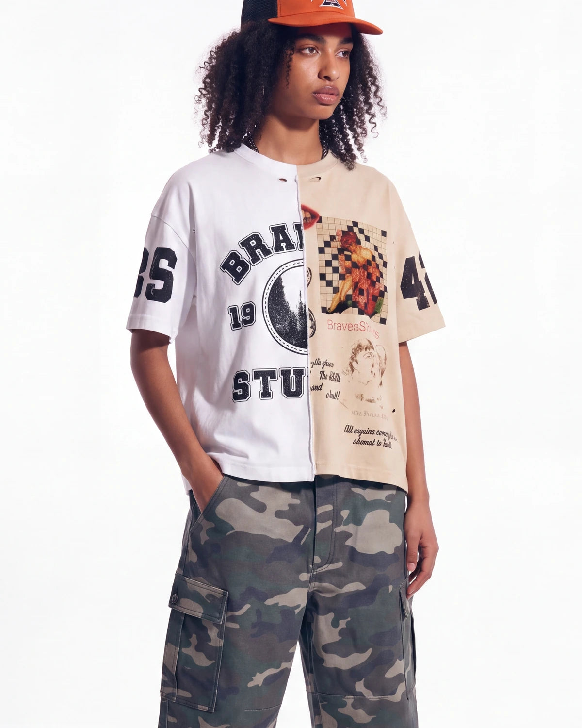Bravest Studios Half Puzzle Tee tan, upper body front view on model showing the split varsity and animal panels