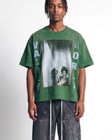 Vale Forever Vale World II Tee green, upper body front view on model showing the photo-box graphic and VALLEY WORLD lettering