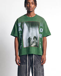 Vale Forever Vale World II Tee green, upper body front view on model showing the photo-box graphic and VALLEY WORLD lettering