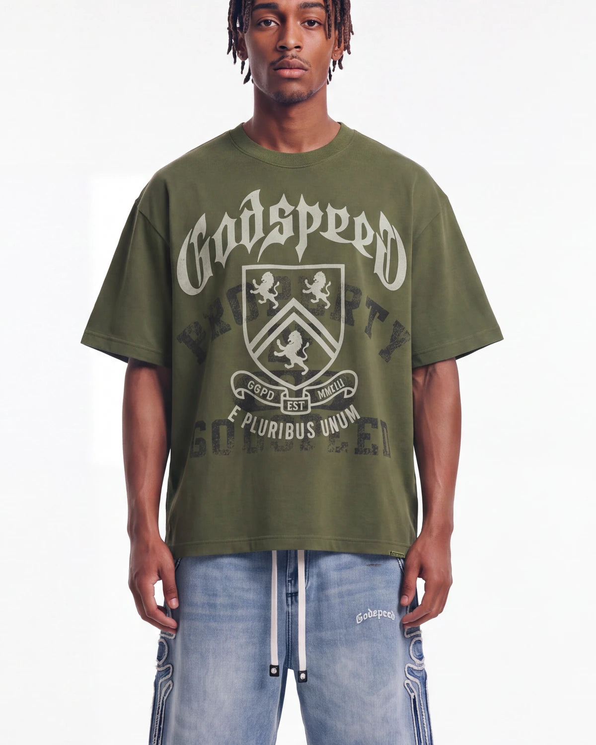 Godspeed Collegiate Tee Olive Wash, cropped on-model front view showing the crest graphic and boxy fit