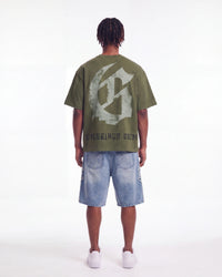 Godspeed Collegiate Tee Olive Wash, worn by a model showing the gothic G monogram back print, full back view
