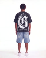 Godspeed Silencio Tee Black Wash, worn by a model, full-length back view showing the G monogram print