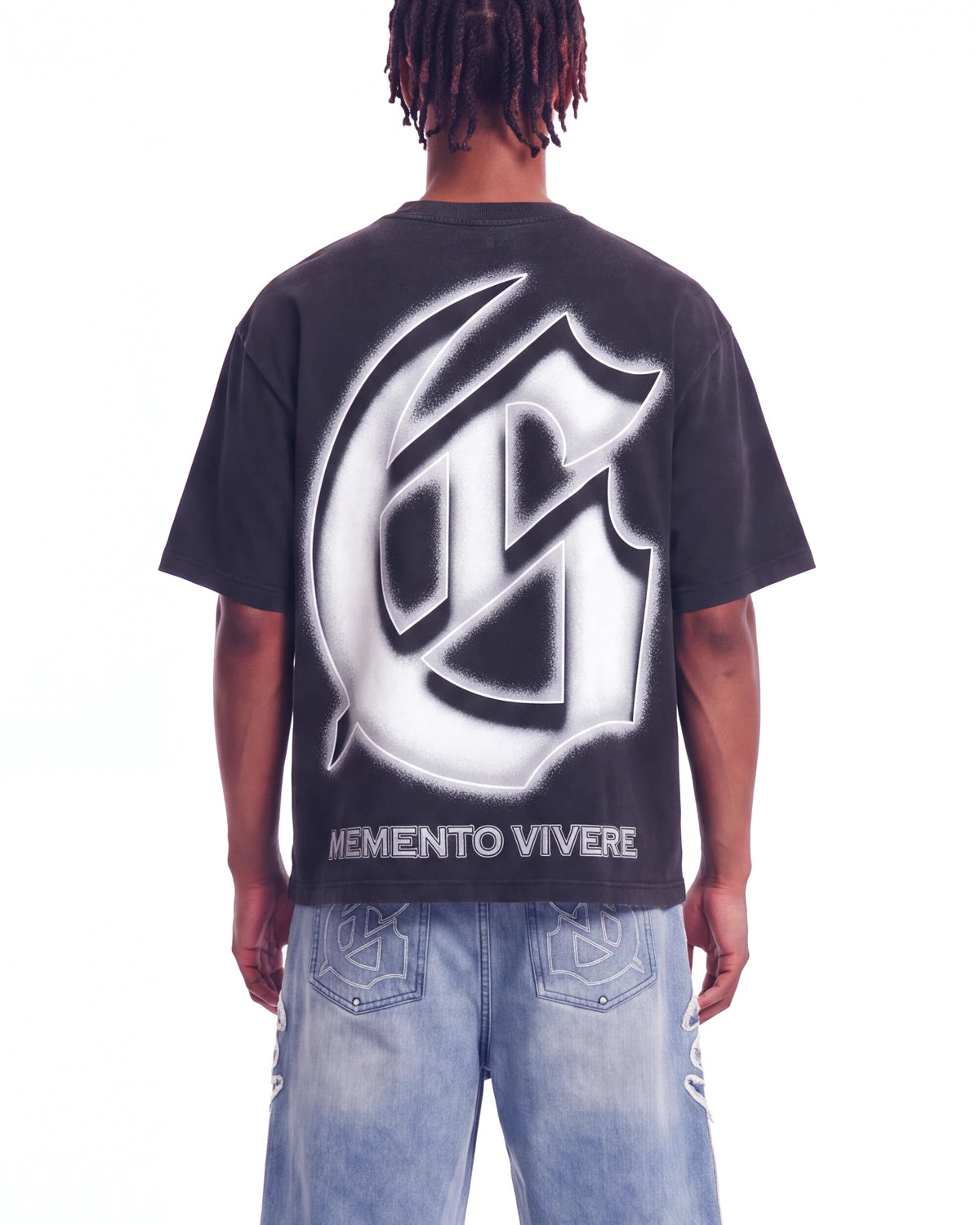 Godspeed Silencio Tee Black Wash, cropped on-model back view showing the G monogram