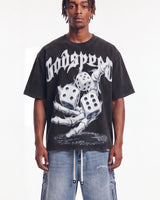 Godspeed No Risk No Reward Tee Black Wash, cropped on-model front view showing the dice graphic and boxy fit