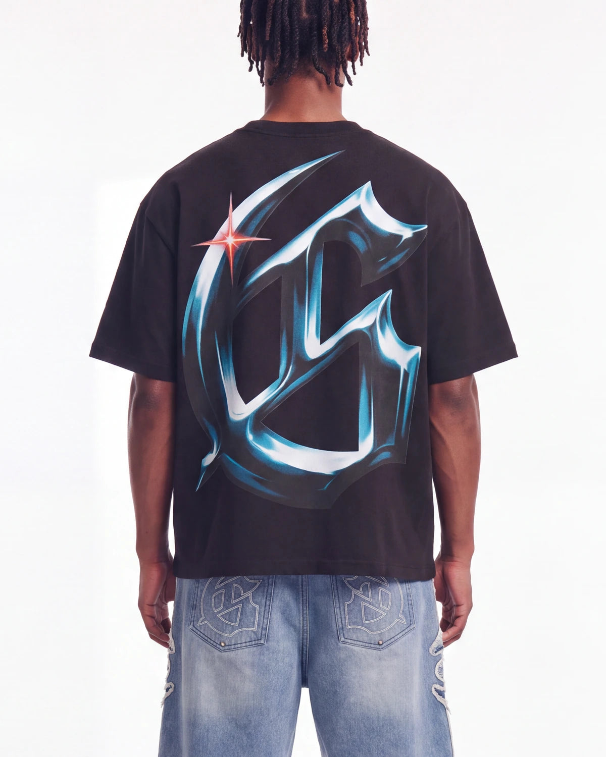 Godspeed New Age Reloaded Tee Black, cropped on-model back view showing the chrome G monogram
