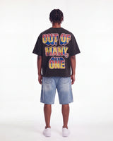 Godspeed Finally Tee black, full rear view on model showing the OUT OF MANY, ONE block lettering