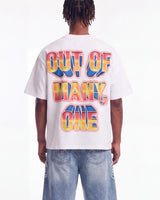 Godspeed Finally Tee white, upper body rear view on model showing the OUT OF MANY, ONE block lettering