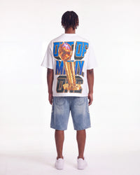 Godspeed Liberty Reigns Tee white, full rear view on model showing the gold trophy and OUT OF MANY, ONE lettering