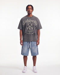 Godspeed Collegiate Tee Grey Wash, worn by a model with light wash denim shorts, full front view