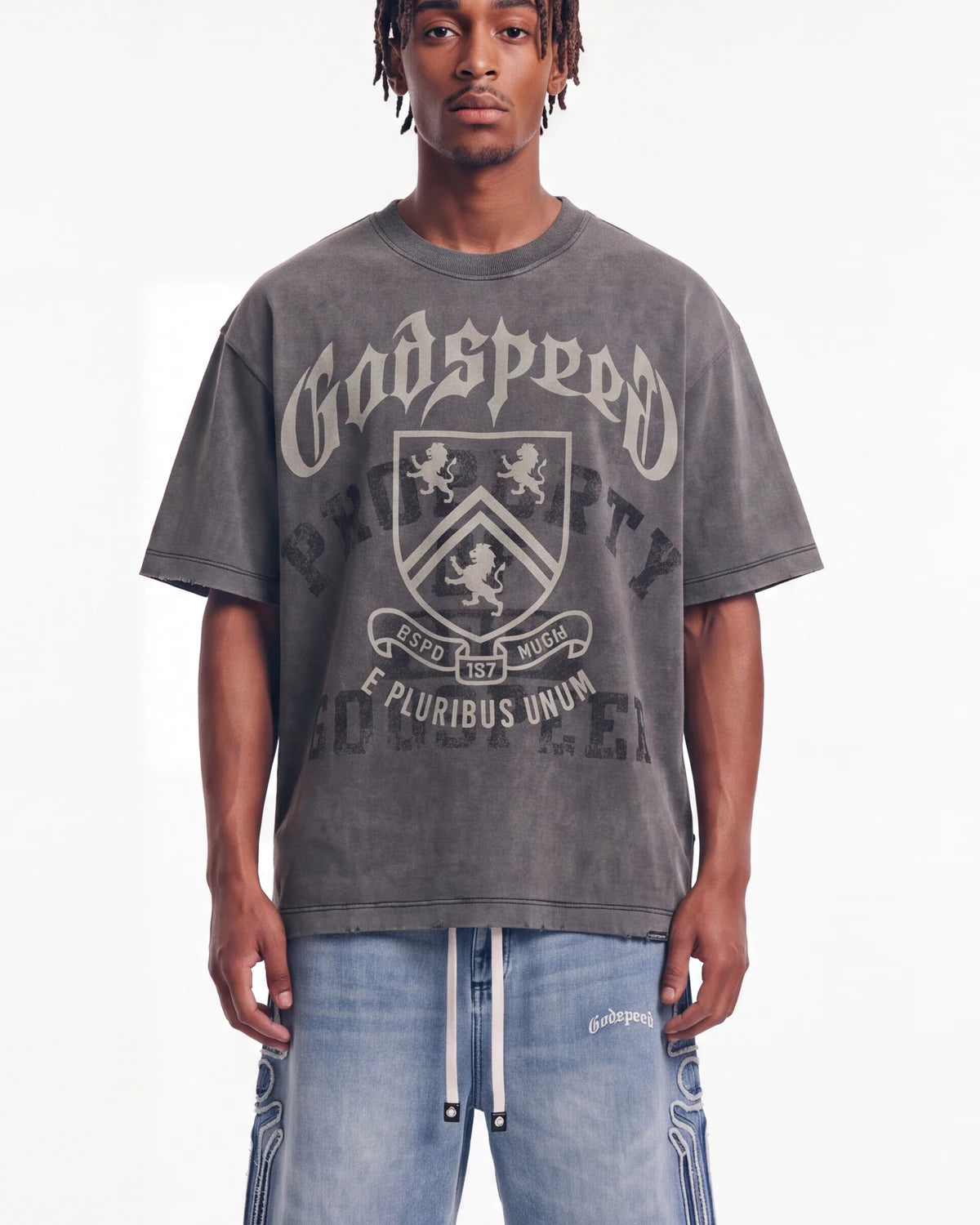Godspeed Collegiate Tee Grey Wash, cropped on-model front view showing the crest graphic and boxy fit