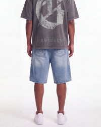 Godspeed Femur Frayed Denim Shorts Blue, worn on-model back view showing the bone appliqué seams