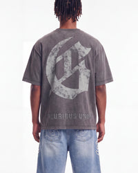 Godspeed Collegiate Tee Grey Wash, cropped on-model back view showing the gothic G monogram