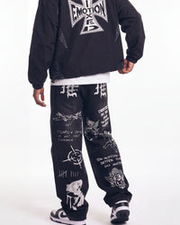 Mixed Emotions Canvas Denim black, waist-down rear view on model showing the Old English ME letters