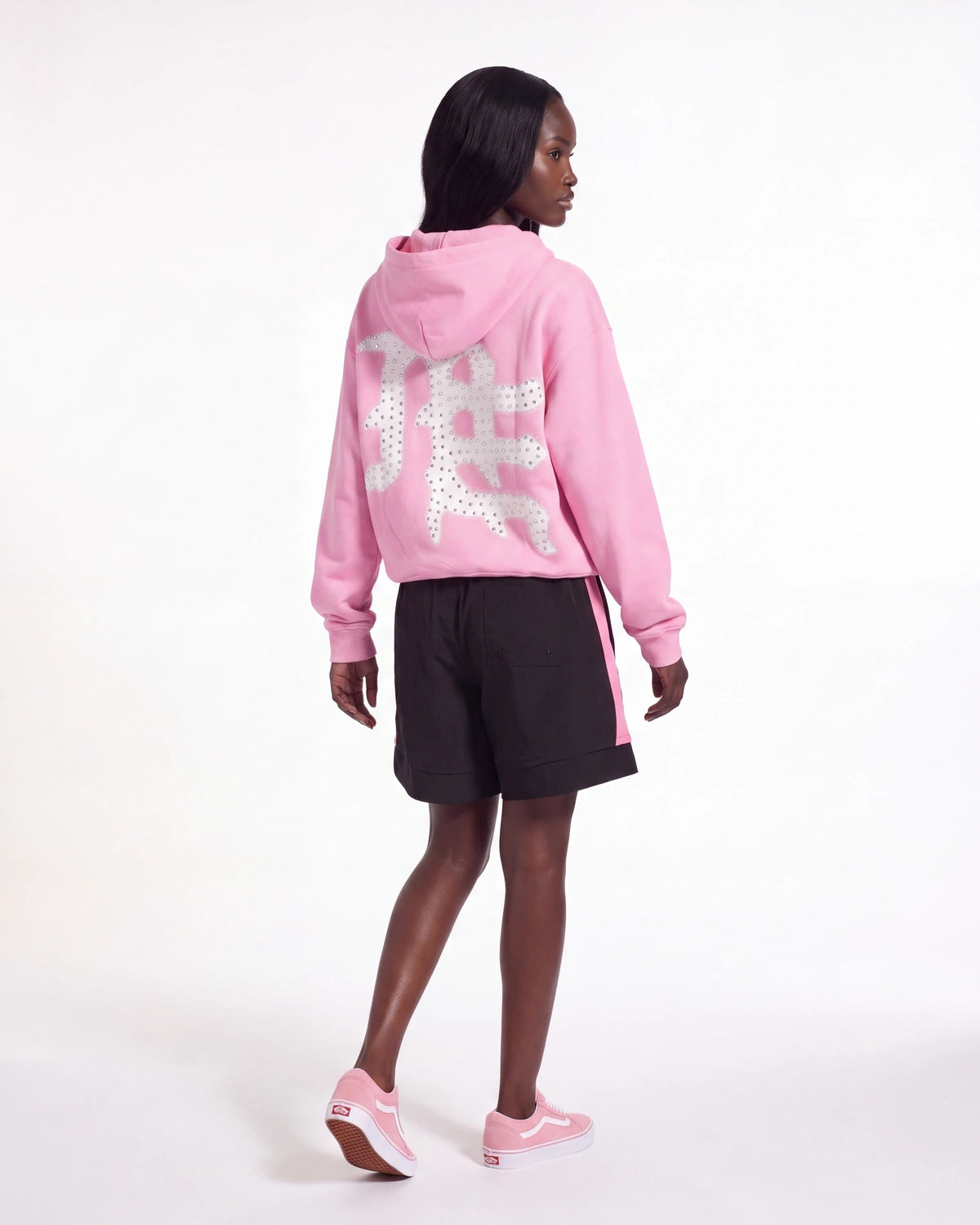 Sp5der Soccer Double Layer Shorts black, full rear view on model worn with a pink zip hoodie