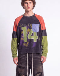 Vale Forever Boomerang L/S Tee black, upper body front view on model showing the appliqué 14 and colorblock sleeves
