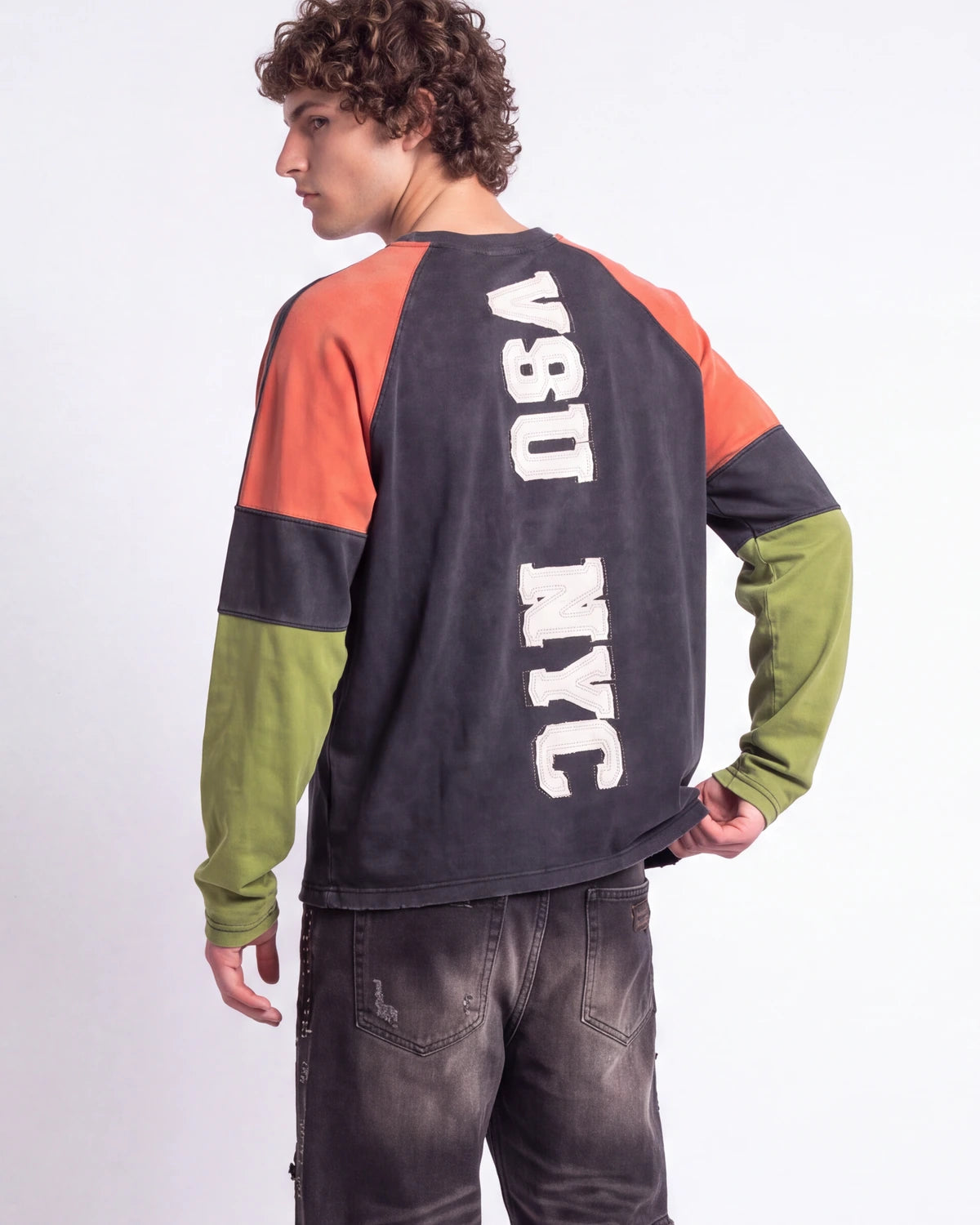 Vale Forever Boomerang L/S Tee black, upper body rear view on model showing the VSU NYC varsity lettering