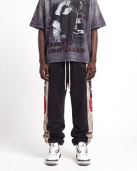 Vale Forever Vale Star Sweatpants black, front view on model showing the tan side panels and drawcord waist