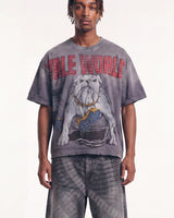 A model wearing a gray oversized graphic t-shirt with a bulldog print and red 'DIBLE WORLD' text, paired with matching gray tie-dye pants, against a plain white background.