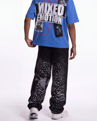 Mixed Emotions Striped Sweatpants black, waist-down rear view on model showing the zebra-stripe fade