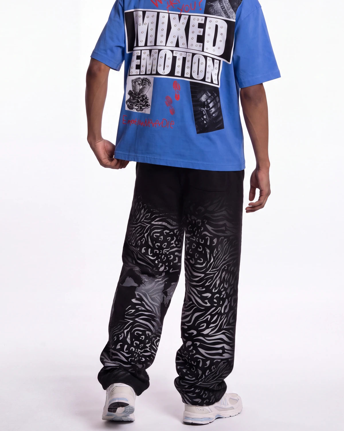 Mixed Emotions Striped Sweatpants black, waist-down rear view on model showing the zebra-stripe fade