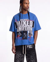 Mixed Emotions Lost Identity Tee blue, upper body front view on model showing the rhinestone MIXED EMOTION logo and photo panels