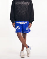 Sp5der Soccer Double Layer Shorts blue, front view on model showing the sp5der wordmark and white side panels