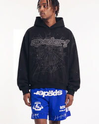 Sp5der P*nk V2 Rhinestone Hoodie black, upper body front view on model showing the rhinestone spider wordmark and tonal web