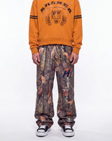 HMDD Chim Tree H-Star Nylon Pants camo, waist-down front view on model showing the camo print and H-star logo