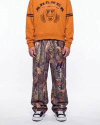 HMDD Chim Tree H-Star Nylon Pants camo, waist-down front view on model showing the camo print and H-star logo