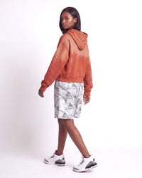 Sp5der Realtree OG Web V2 Sweat Shorts white camo, side and rear view on model worn with an orange zip-up hoodie