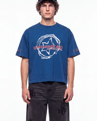 A man wearing a blue short-sleeve t-shirt with a white distressed graphic and red 'CHIMHEAD' text on the chest, paired with dark gray jeans, photographed against a plain white background.