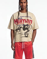 All Human The Pines Tee cream, upper body front view on model showing the motocross race graphic