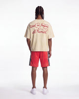All Human The Pines Tee cream, full rear view on model showing the Work in Progress 1994 red script