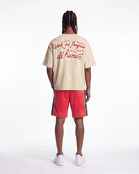 All Human The Pines Tee cream, full rear view on model showing the Work in Progress 1994 red script