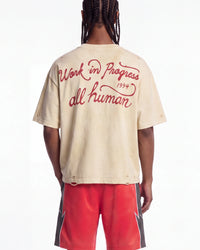 All Human The Pines Tee cream, upper body rear view on model showing the red script back print