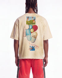 All Human Requiem For A Dream Tee cream, upper body rear view on model showing the pill-shaped balloon collage