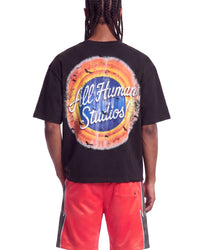 All Human Like Mike Tee black, upper body rear view on model showing the All Human Studios roundel