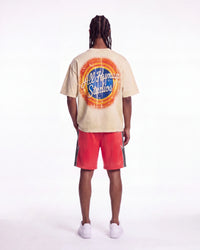 All Human Lefrak Tee cream, full rear view on model showing the All Human Studios sunburst roundel