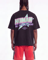 All Human Hereditary Tee black, upper body rear view on model showing the HUMAN lettering over a mint star