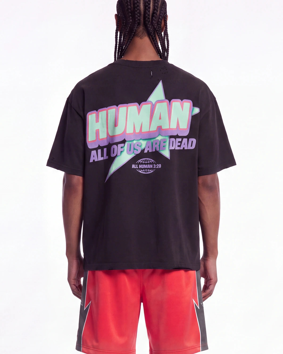 All Human Hereditary Tee black, upper body rear view on model showing the HUMAN lettering over a mint star