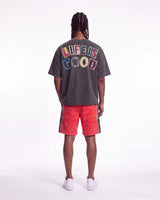 Godspeed Halftime Shorts V2 Red Acid Wash, worn by a model, full-length back view