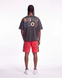 Godspeed Halftime Shorts V2 Red Acid Wash, worn by a model, full-length back view