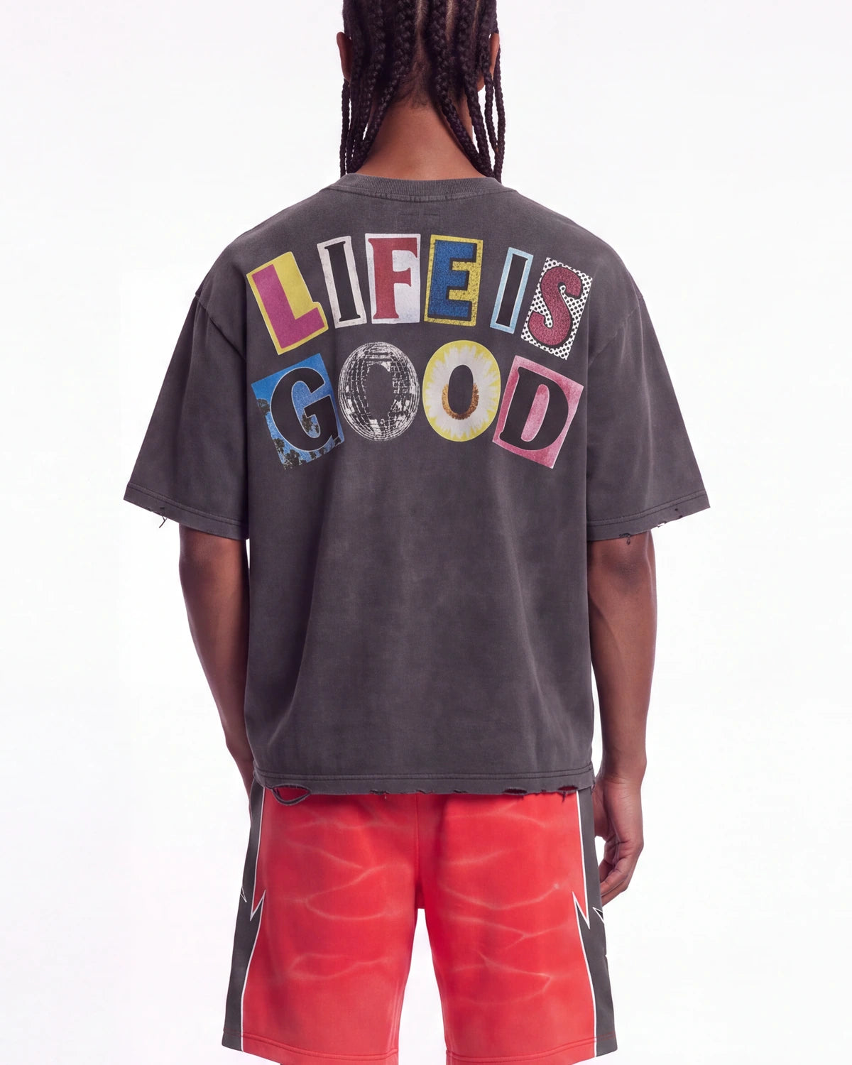 All Human Copy & Paste Tee black, upper body rear view on model showing the multicolored LIFE IS GOOD letters
