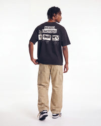 Mixed Emotions Stamped Tee black, full rear view on model showing the stamped MIXED EMOTION back graphic
